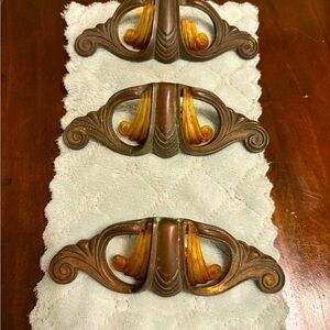 Set of 3 circa 1930’s Bakelite and bronze art deco cabinet pulls.